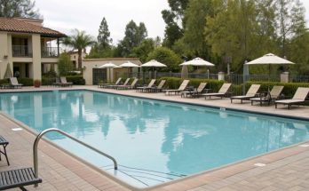 Illustration of a swimming pool with rental business signage, emphasizing zoning compliance and smart monetization strategies