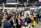 Entrepreneurs and suppliers networking on the busy exhibition floor at White Label World Expo 2026 at the Las Vegas Convention Center