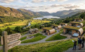 A scenic glamping pod site on a hillside in the Lake District with views across a valley, representing a UK camping land investment opportunity in 2026