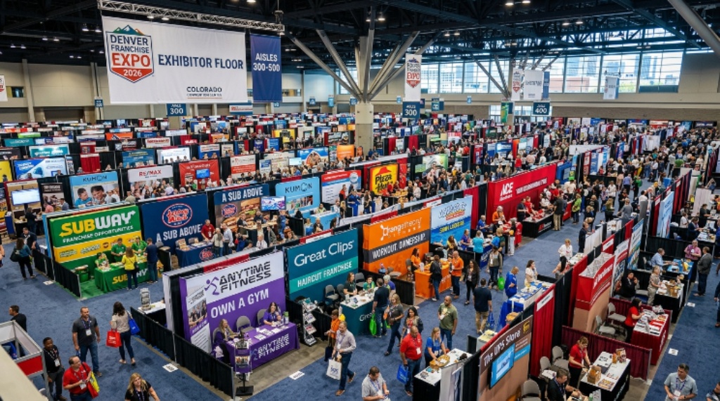 A wide-angle view of the exhibitor floor at the Denver 2026 franchise expo showing multiple branded booths